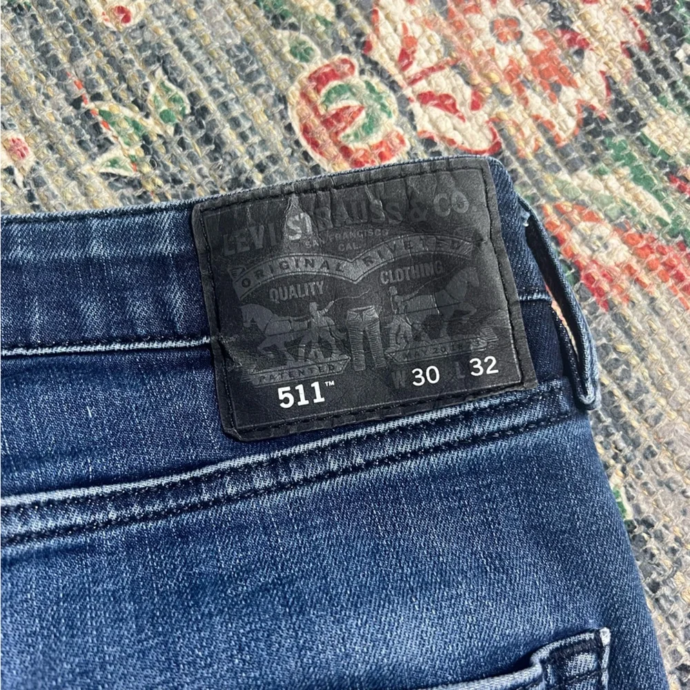 Levi’s 511 green pocket slim fit distressed denim jeans